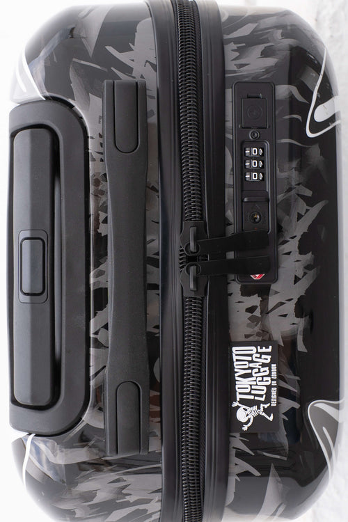 Top of suitcase with superhero  Batman design and digital display on a white background