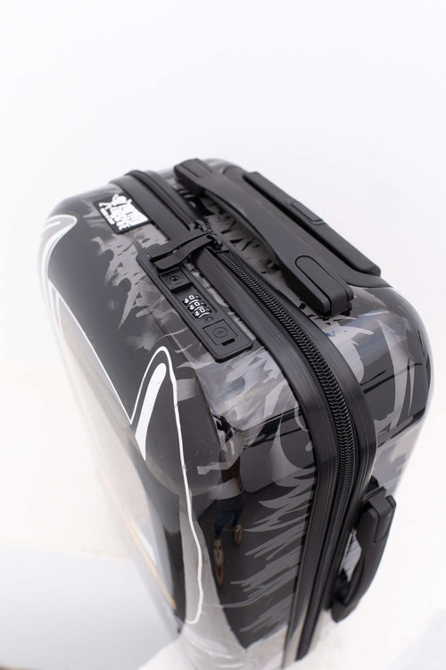 Black Batman suitcase with white patterns on a white background