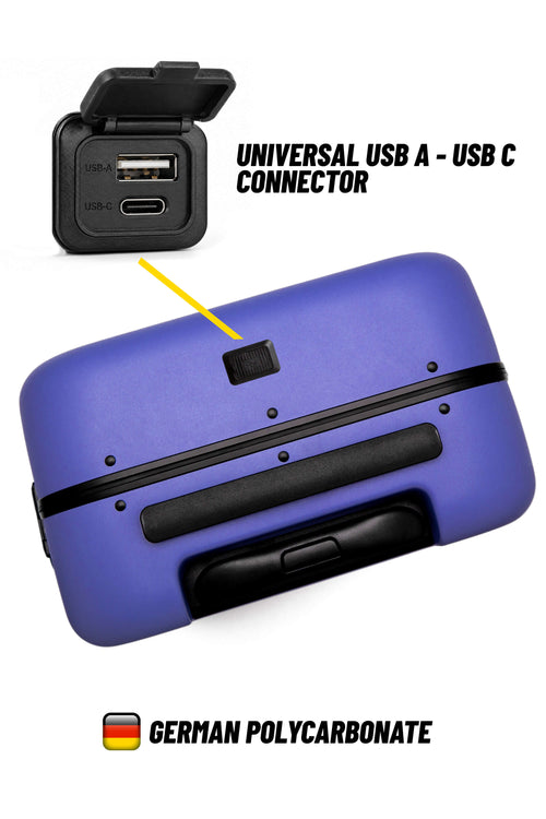 A purple hard-shell suitcase shown on a white background with a callout pointing to a small black port on the top. Text reads 'UNIVERSAL USB A - USB C CONNECTOR' and 'GERMAN POLYCARBONATE,' with a small German flag icon.