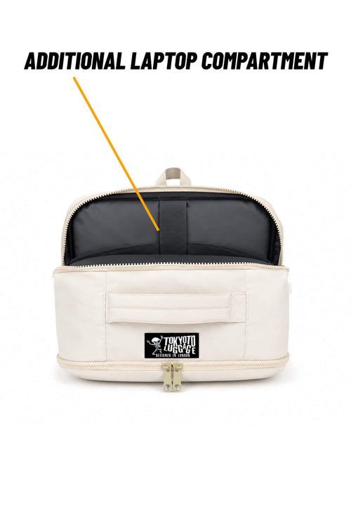 An open cream-colored Tokyo Luggage backpack with a black interior laptop compartment, featuring a text overlay that reads 'ADDITIONAL LAPTOP COMPARTMENT' with an arrow pointing to the interior pocket.